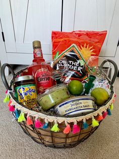 a basket filled with condiments and drinks