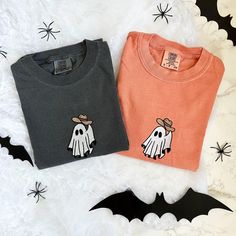 Embroidered Cowboy Ghost Shirt, Embroidered Western Halloween Tshirt, Howdy Halloween - Embroidered Items are stitched to order. Please allow 1-2 weeks for items to ship.  - Unisex Comfort Colors Crewneck tshirt - Designed with pre-shrunk soft air-jet spun yarn - Loose fit for a comfortable feel * Sizing and Colors - Please refer to sizing and color charts in the images * Fabrication - 80% cotton, 20% polyester * Care Instructions - Turn inside out and machine wash cold on delicate cycle - Dry o Black Embroidered Tops For Halloween, Halloween Cotton Top With Embroidered Graphics, Halloween Embroidered Long Sleeve T-shirt, Halloween Long Sleeve Embroidered T-shirt, Halloween Embroidered Cotton Tops, Halloween Cotton Embroidered Tops, Embroidered Long Sleeve T-shirt For Halloween, Embroidered Cotton Tops For Halloween, Halloween Embroidered Crew Neck T-shirt