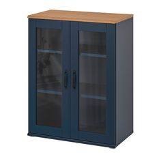 a blue cabinet with two glass doors on the front and one door open to reveal a vase