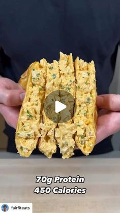 a person holding some food in their hands with the caption 70g protein 450 calories