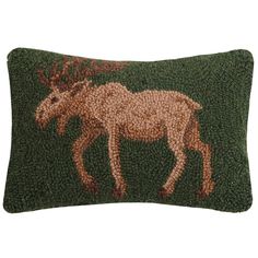 a green pillow with an image of a moose on it