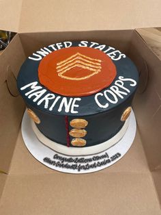 a cake in a box with the words united states marine corp on it