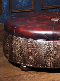 the foot stool is made out of wood and leather