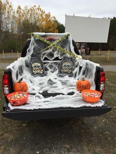 the back end of a truck decorated for halloween