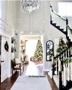 an image of a house with stairs and christmas trees on the front door, which is decorated for the holidays