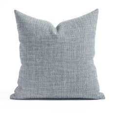 a gray pillow with white lines on the front and back, sitting against a white background