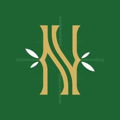 the letter w is made up of two branches and leaves on a green background with white lettering