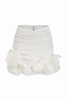 Add a touch of elevated elegance to your wardrobe with our Asymmetrical Hem Ruffle Ruched Skirt. This pleated skirt features intricate ruching and is adorned with delicate 3D flowers along the hem. Perfect for any occasion, this skirt effortlessly combines femininity and sophistication. Pair it with this ruffle top. Silhouette: Pleated Material: Polyester Elasticity: Slight Stretch Closure: Zipper Lined The Model is wearing size S Pleated Flowy Draped Skirt For Party, Pleated Draped Skirt With Flowy Fit For Party, Flowy Pleated Draped Skirt For Party, Feminine Fitted Mini Skirt With Gathered Details, Fitted Feminine Gathered Mini Skirt, Feminine Pleated Skirt Bottoms For Party, White Ruffle Hem Skirt For Party, Elegant Mini Skirt With Ruffles, Elegant Ruffled Bottoms For Party