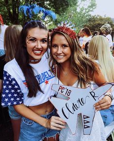 two young women are posing for a photo together