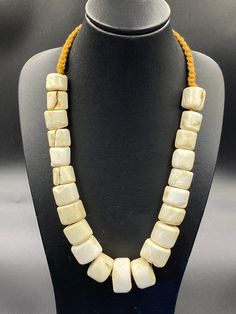 Old ancient African shell beaded necklace Traditional Adjustable Rectangular Necklace, Traditional Adjustable Rectangular Necklaces, Bohemian Jewelry With Large Rectangular Beads, Traditional White Necklaces With Natural Stones, Traditional Cream Handmade Necklace, Traditional Handmade Cream Necklace, Beige Large Beads Jewelry Gift, Traditional Beaded Beige Jewelry, Traditional Gemstone Beads Jewelry For Beach