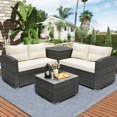 an outdoor patio furniture set on a wooden deck