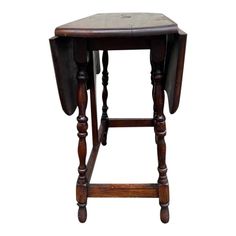 an old wooden stool with two legs and a seat on the backrest, against a white background