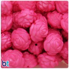 a pile of pink plastic balls sitting next to each other