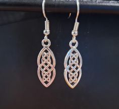 Celtic Knot earings.  Dangles about 1.75 inches. Available in gold tone or silver tone. Hypoallergenic hooks. Celtic Knot Earrings, Knot Earrings, Oct 1, Celtic Knot, Favorite Jewelry, Jewelry Earrings Dangle, Knot, Dangle Drop Earrings, Silver Tone