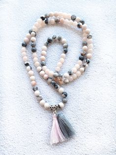 This delicate japa mala necklace is made with 108 natural stone 6mm beads of pink zebra jasper adorned with silver beads. This prayer garland  is the perfect support garland for counting mantras during your practices. Its a 108 6mms beads mala, very light weight and delicate, a spiritual sacred jewelry for chakra healing. All our malas are very versatile, since you can use them on many occasions.hanging from the neck, with a turn or two. on the wrist, with several turns. I make each mala by hand, knotting each of the 108 beads with great care and I made every single silky and delicate tassel. I use a very resistant braided macrame rope, achieving a mala that lasts over time. All our malas are very versatile, since you can use them on many occasions. Spiritual Stone jewels choose personally Pink Zebra Jasper, Pink Jasper, Braided Macrame, Sacred Jewelry, Mala Jewelry, Beads Mala, Yoga Mindfulness, Chakra Yoga, Zebra Jasper