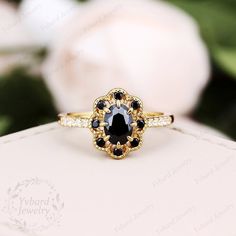 "Please confirm your US size when you make an order) Jewelry Details -Gold Type: Solid 10K Gold / Solid 14K Gold / Solid 18K Gold (Choose One in Material Option) Center Stone: Natural Black Sapphire, Approximately 0.85ct Stone Size: 5*7mm Cut: Oval Cut Side Stone 1: Natural Black Sapphire, 0.14ctw Cut: Round Cut Side Stone 2: Natural Diamond, 0.10ctw Color: G-H Clarity: SI1 Cut: Round Cut / 3EX Band Width: Approximately 1.5mm SKU: YR0639 ~*-*~Purchase Guarantee: - All our jewelry is handmade, an Black Oval Cluster Ring For Anniversary, Black Anniversary Rings With Halo Detail, Luxury Black Promise Rings, Black Round Halo Ring, Black Rings With Halo Setting For Gift, Heirloom Black Round Cut Ring, Heirloom Black Diamond Ring For Gift, Black Heirloom Ring With Center Stone, Black Halo Rings For Gift