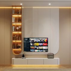 a flat screen tv sitting on top of a white entertainment center next to a book shelf