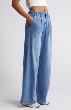 Make a statement in these pleated, vintage-inspired jeans fashioned with trouser-style pockets and superwide legs that sway with every step. 32" inseam; 30" leg opening; 11 1/2" front rise; 15 1/2" back rise Zip fly with button closure Side slant pockets 63% cotton, 27% polyester, 8% rayon, 2% spandex Machine wash, tumble dry Imported Relaxed Fit Flare Jeans With Pockets, Relaxed Fit Flare Jeans For Elevated Casual, Denim Wide Leg Pants For Work, Light Wash Wide Leg Flare Jeans For Work, Wide Leg Light Wash Flare Jeans For Work, Spring Wide Leg Flare Jeans For Elevated Casual, Wide Leg Washed Blue Jeans For Work, Relaxed Fit Wide Leg Jeans For Work, Wide Leg Relaxed Fit Jeans For Work