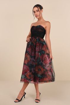 Stunning and sweet, the Lulus Splendidly Yours Black Floral Organza Mesh Strapless Midi Dress is the perfect treat! Shiny floral organza shapes this exceptional dress with a black, sheer mesh overlay that adorns a strapless, ruched bodice with seamed cups and a sweetheart neckline (with hidden no-slip strips). High, fitted waist sits atop a matching skater skirt that falls to a chic midi hem. Hidden back zipper/clasp. Fit: This garment runs small - please size up. Length: Mid-calf length. Size medium measures 38.5" from top to bottom. Bust: Works best for A to C cup sizes - consider sizing up for fuller bust. Waist: Fitted - very fitted at natural waist. Hip: Not Fitted - fuller skirt allows room for hips. Undergarments: May be worn with a strapless bra, adhesive bra, petals, or no bra. Fa Holiday Formal Dresses, Holiday Dresses Women, New Years Eve Dresses, Eve Dresses, Strapless Midi Dress, Wedding Guest Dresses, Autumn Dress, Ruched Bodice, Mesh Overlay