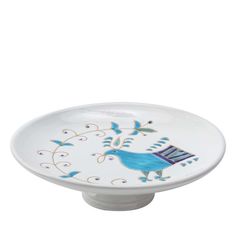 a white plate with blue birds on it