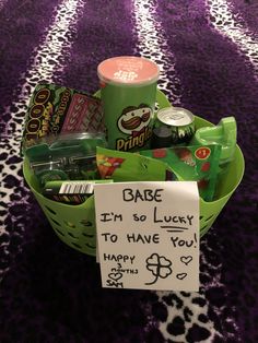 a basket filled with lots of different items on top of a purple carpeted floor