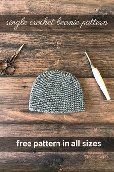 a knitted hat and pair of shears on a wooden table with the text, free pattern in all sizes