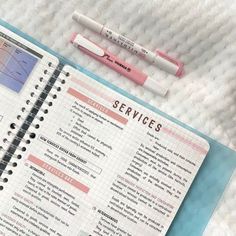 a notebook with some writing on it next to a pen and eraser that says services