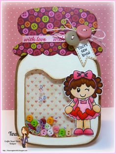 a card with buttons and a girl in a jar