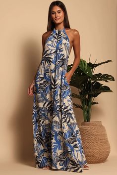 Front view of the Parrot Blues Hannah Halter Maxi Dress by Shore Halter Neck Floral Maxi Dress For Beach Season, Tropical Halter Dress For Spring Vacation, Blue Floral Print Halter Dress For Vacation, Tropical Print Halter Neck Dress, Spring Vacation Tropical Halter Dress, Blue Tropical Print Maxi Dress For Beachwear, Summer Tropical Print Halter Dress, Summer Halter Dress With Tropical Print, Blue Tropical Maxi Beach Dress