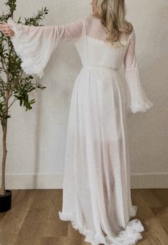 LUXE SHEER ROBE | bridal | floor length  We also offer the LUXE PEARL SLIP sold separately 🤍  The purchase includes the robe and tie belt. The robe is floor length, made with a stretchy  soft sheer tulle.  Due to increased demand, we do offer "Rush My Order" on our page. Please see the listing on our page for more information, or send us a message.  It is an absolutely stunning floor length robe, perfect for a bridal look. 🤍 PROCESSING TIME: Please review the processing time of your order and Floor Length Robe, Sheer Robe, Bridal Robe, Belt Tying, Bridal Look, Pajama Robe, Bridal Robes, Womens Robes, Bridal Looks