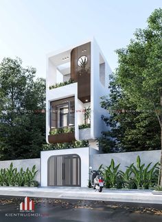 a white building with plants growing on it's balconies and balconyes