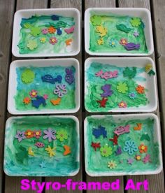 four square trays with flowers and butterflies painted on them sitting on a wooden table