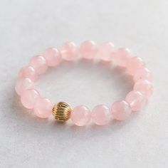 *This listing is for 1 genuine AAA Madagascar Rose Quartz bracelet, select your option in the drop down menu Madagascar Rose Quartz is a rare, classic 'rose' pink gemstone from Madagascar's Antananarivo Province. A romantic gemstone historically known as the 'gem of love', Madagascan Rose Quartz is noted for its superior quality. Rose Quartz: self love, love, unconditional love, joy, inner peace, connection, matters of the heart   D E T A I L S △ Handmade in Canada △ AAA Madagascar Rose Quartz 1 Rose Gold Rose Quartz Jewelry With 8mm Beads, Elegant Rose Quartz Bracelets For Valentine's Day, Elegant Rose Quartz Bracelet For Valentine's Day, Elegant Stackable Rose Quartz Jewelry, Rose Gold Round Bracelets For Valentine's Day, Classic Rose Gold Round Beaded Bracelets, Elegant Pink Stackable Stretch Bracelet, Classic Pink Bracelets, Pink Rose Quartz Round Stretch Bracelet