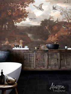 a bathroom with a large painting on the wall next to a bathtub and sink