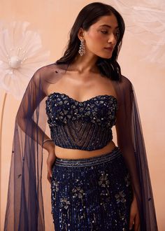 Heavily embellished lehenga and corset with cutwork details on neckline with floral and line embroidered motifs paired with dupatta. Styling Dupatta, Sangeet Lehenga, Navy Blue Lehenga, Western Lehenga, Wedding November, Wedding Fits, Sheer Dupatta, Pre Bridal, Blouse Lehenga