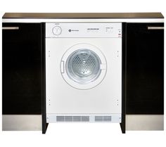 a white and black washer sitting inside of a cabinet