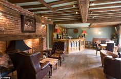 a living room filled with furniture and a fire place