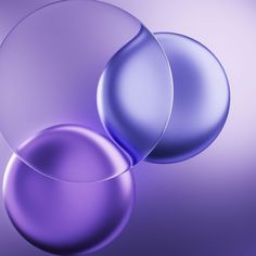 three shiny balls on a purple background