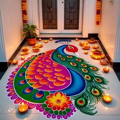 a colorful peacock is on the floor surrounded by candles