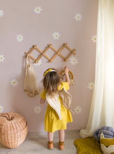 "Keep the warmth of summer in your little one's room with our new Simple Daisy Flower Wall Decals. These simple daisies are a great way to brighten up any kid's room or nursery. Their simplistic design and easy application make it the perfect project for any child and parent to enjoy! Daisy Size: (approx): 4.5\" x 4.5\" [What's Included] > 45 flowers > 50 flower centers [Choosing Colors] > Color A (Set of Flowers): Choose 1 color > Color B (Set of Flower Centers): Choose 1 color During checkout, Daisy Decals Bedroom, Flower Wall Kids Room, Flower Mural Kids Room, Daisy Wall Nursery, Boho Daisy Bedroom, Light Pink Toddler Room, Painted Daisy Flower, Daisy Bedroom Ideas Kids Rooms, Girls Daisy Bedroom