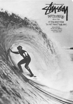 a man riding a wave on top of a surfboard