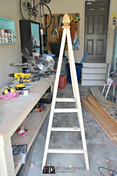 a wooden ladder sitting in the middle of a room