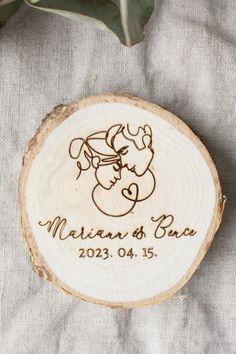 a wooden slice with a baby's name engraved on it