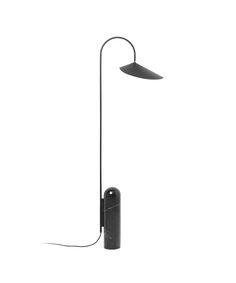 a black lamp on a white background with the light turned off and plugged in