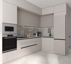 a modern kitchen with white cabinets and black accents on the countertops, along with an oven