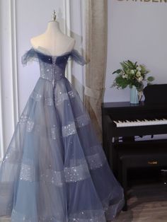 Blue Tulle Ball Gown For Homecoming, Blue Tulle Ball Gown For Prom, Blue Tulle Gown For Homecoming, Blue Prom Gown With Tulle Skirt, Blue Tulle Skirt Prom Gown, Blue Tulle Skirt Gown For Prom, Blue Tulle Gown For Gala, Blue Tulle Skirt Evening Dress, Blue Off-shoulder Gown For Prom