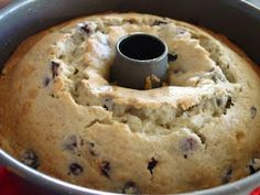 a bundt cake in a metal pan with a black ring on the top that is filled with chocolate chips