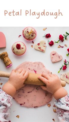 a child is playing with play dough and making cupcakes for valentine's day