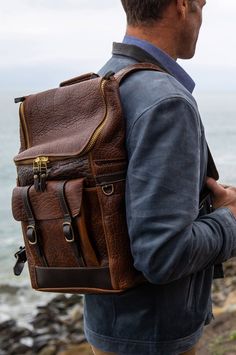 Legacy American Bison Leather Backpack with Concealed Carry Pocket | Overland Textured Leather Travel Backpack, Everyday Textured Leather Standard Backpack, Everyday Textured Leather Backpack, Textured Leather Backpack For Everyday Use, Travel Bag With Zipper Pocket And Pebbled Leather, Travel Bag With Zipper Pocket In Pebbled Leather, Bison Leather, American Bison, Antique Brass Hardware