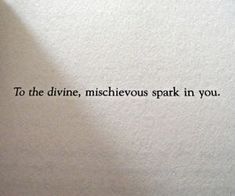 an old typewriter with the words to the divine, mischeous spark in you